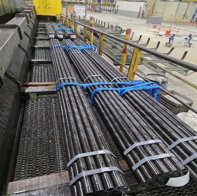 Factory floor — seamless steel tubes bundled